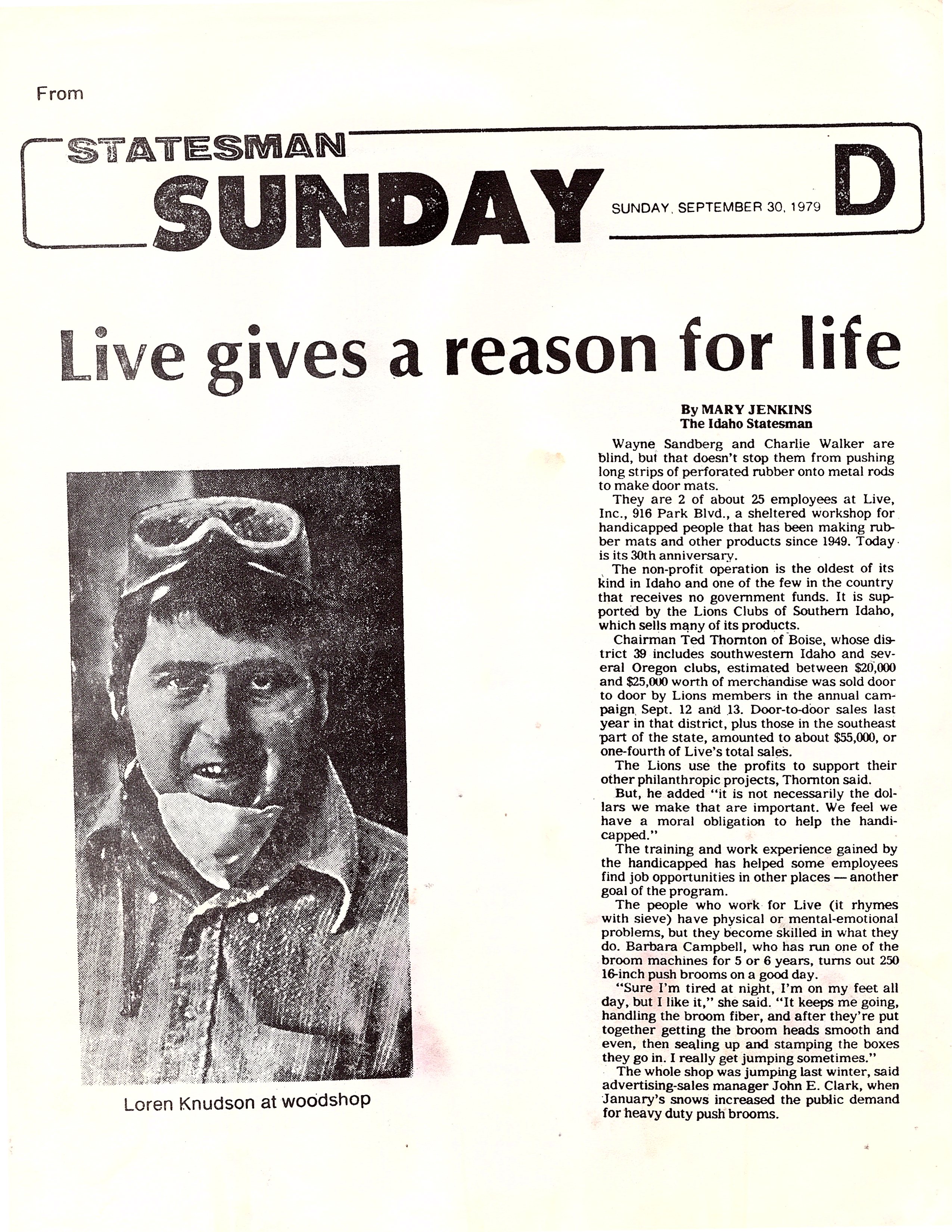 The image is a black-and-white newspaper clipping from the Idaho Statesman, dated Sunday, September 30, 1979. The headline reads: Live gives a reason for life. Below the headline is a photo of Loren Knudson at the Live woodshop. The article mentions individuals named Wayne Sandberg and Charlie Walker, and discusses doormat production and charity work.